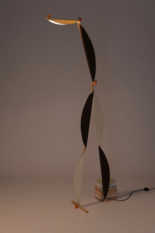 A floor lamp with HALFMOON shade and add-ons