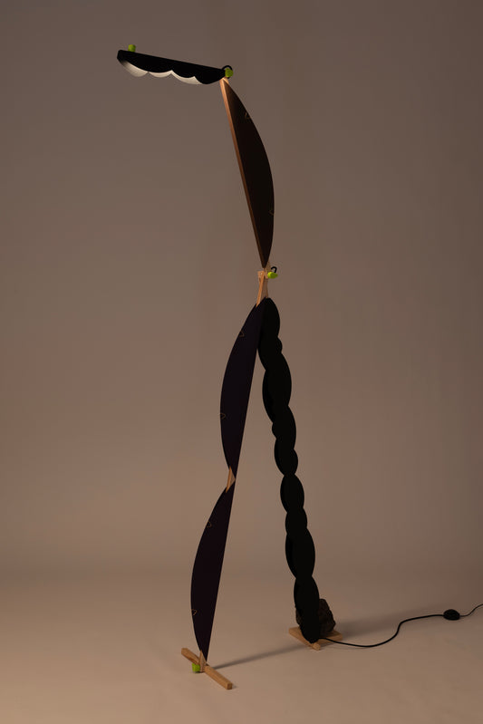 A floor lamp with HALFMOON add-ons & BLIP add-ons and shade