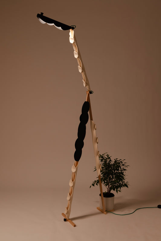 A floor lamp with OLOP sleeve & BLIP add-on and shade