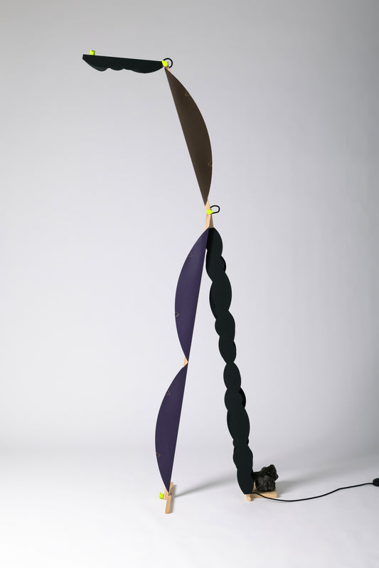 A floor lamp with HALFMOON add-ons & BLIP add-ons and shade