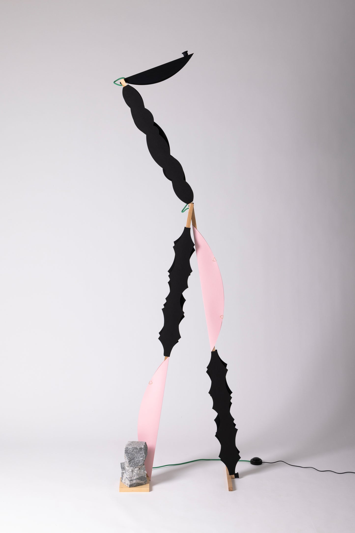 A floor lamp with HALFMOON add-ons and shade & BLIP add-on & DIP add-ons