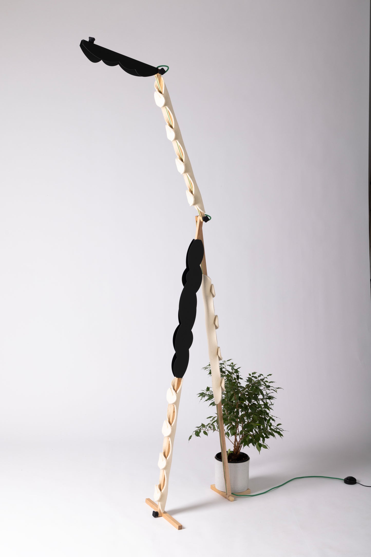 A floor lamp with OLOP sleeve & BLIP add-on and shade