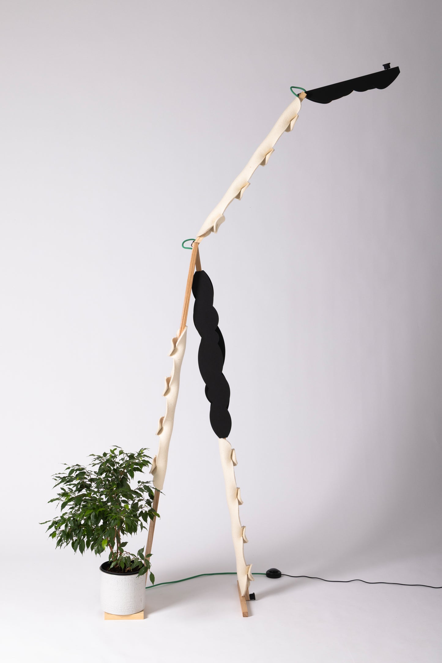 A floor lamp with OLOP sleeve & BLIP add-on and shade
